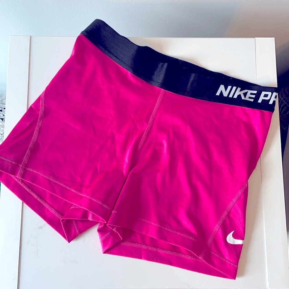 Pink Nike pro spandex shorts.